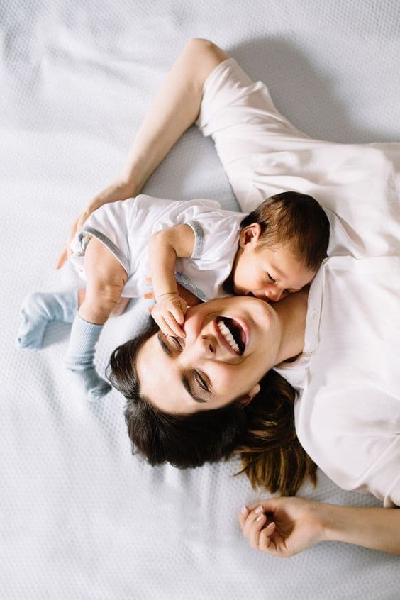 A mother sharing a joyful moment with her baby